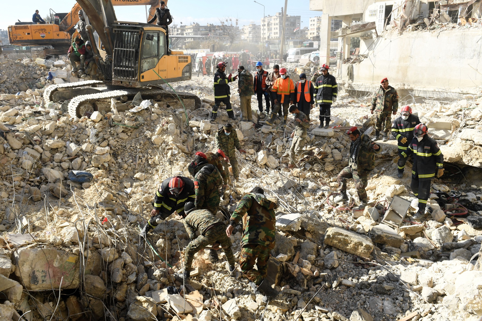 Rescuers search through the rubble.